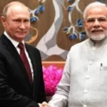 Modi Putin handshaking